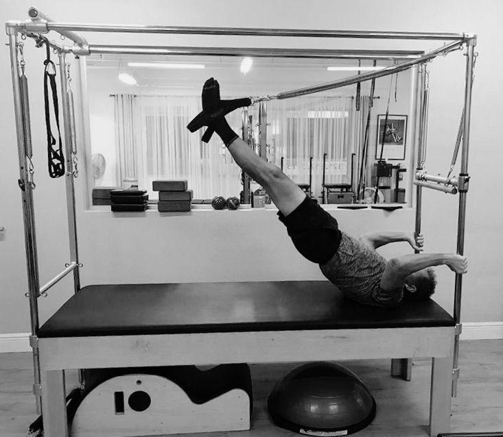 Client in an inverted exercise on the Cadillac