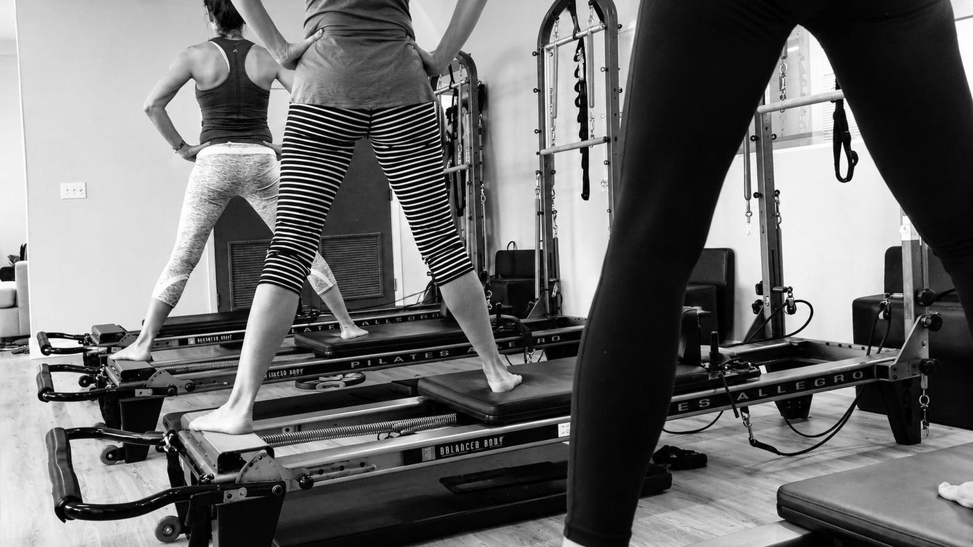 Instructor demonstrating an exercise in the studio